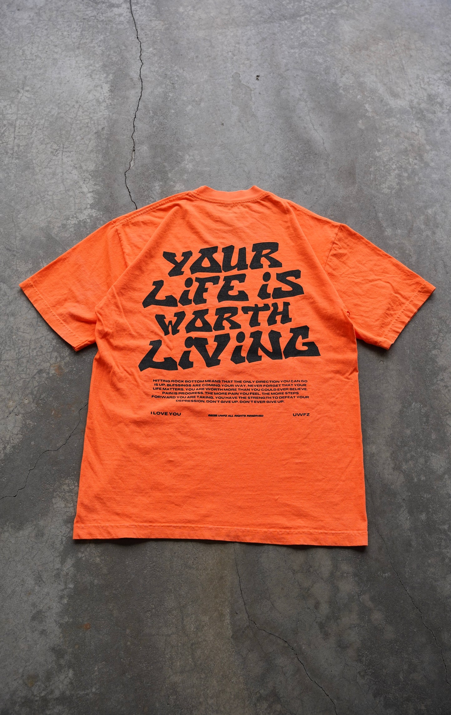 YOUR LIFE IS WORTH LIVING HEAVYWEIGHT TEE - NEON ORANGE