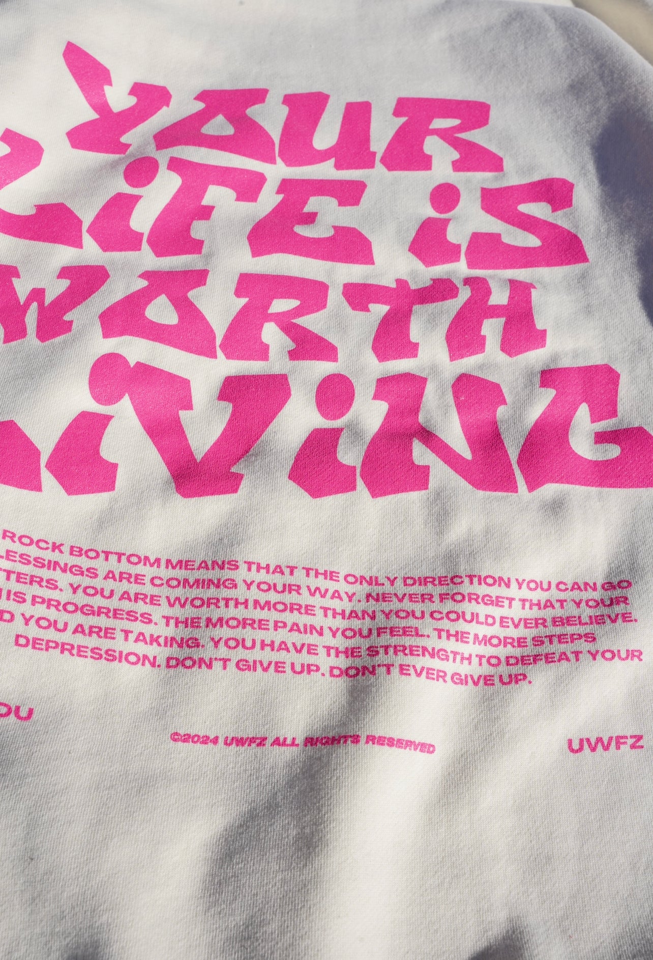 YOUR LIFE IS WORTH LIVING HOODIE - Bone & Pink